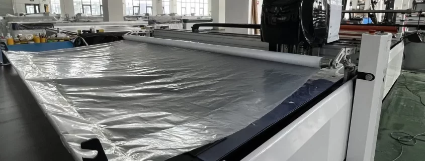 automatic fabric cutting machine plastic film covering fabric 1 845x321 - Blog